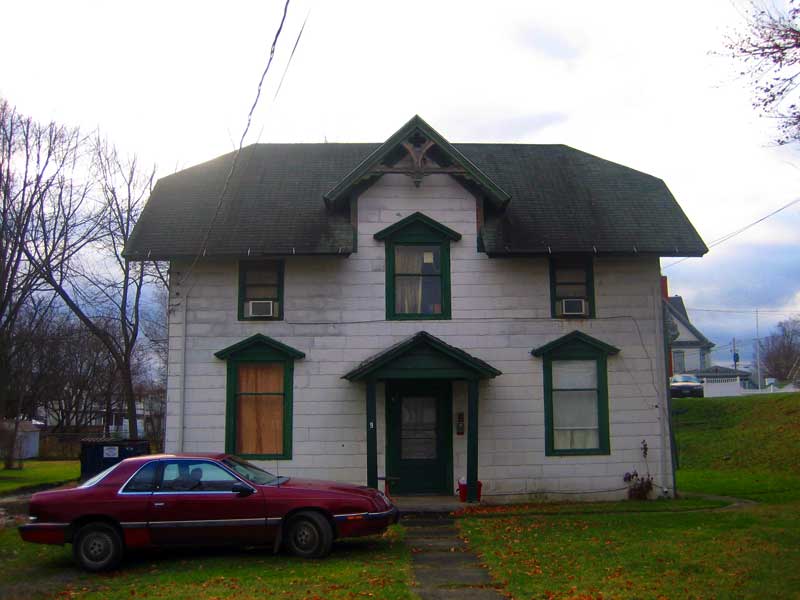2010, front of former carriage house with asbestos siding, before restoration of exterior