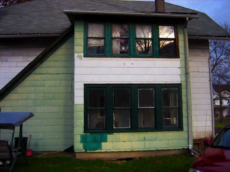 2010, back view of former carriage house with asbestos siding