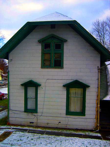 2010, north side of carriage house with asbestos siding, before removal of the siding
