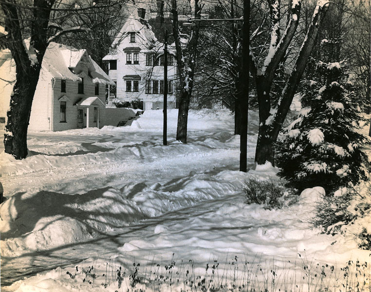 This photo was taken circa 1958, showing the former carriage house at 9 Athens street and the back of the house at 208 Chemung street