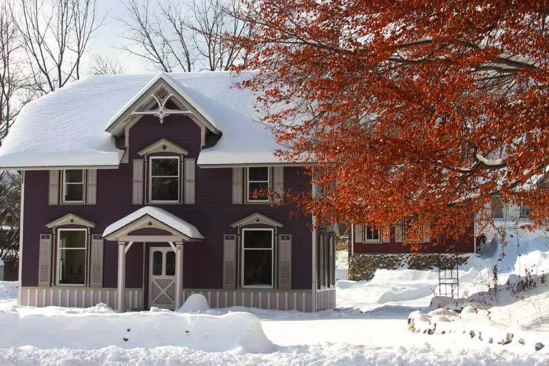 January 2013, front of former carriage house painted purple, back to original wood siding, asbestos all removed